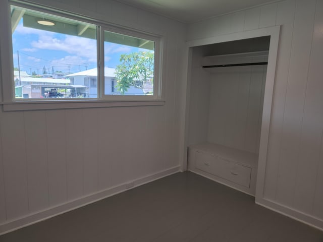 unfurnished bedroom featuring dark wood-style floors