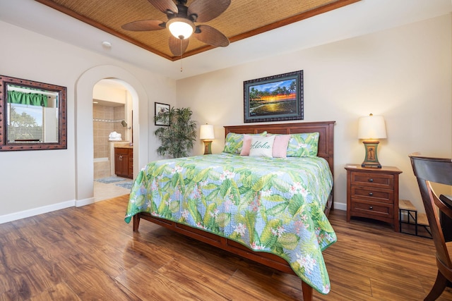 69-180 Waikoloa Beach Dr Unit O2, Waikoloa, HI 96738 - bedroom with wood finished floors, baseboards, ensuite bath, and a raised ceiling
