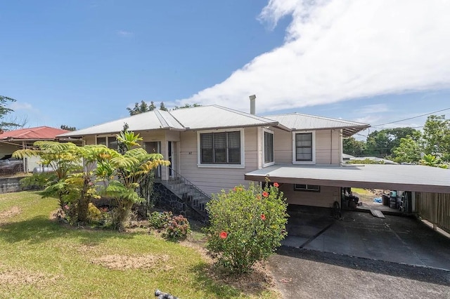 view of front of home featuring a front yard and stairs