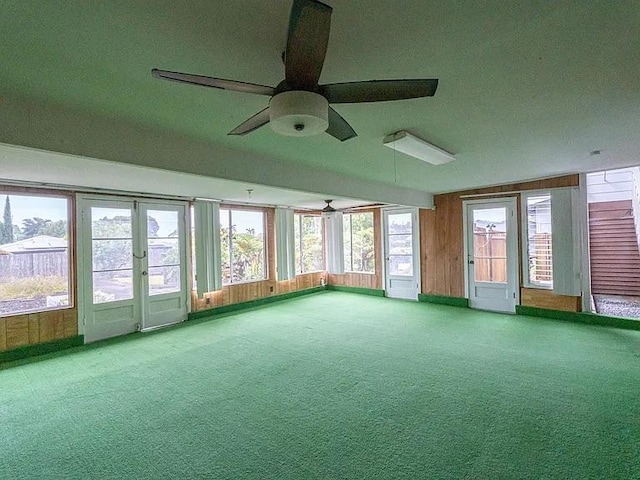 unfurnished sunroom featuring plenty of natural light and french doors