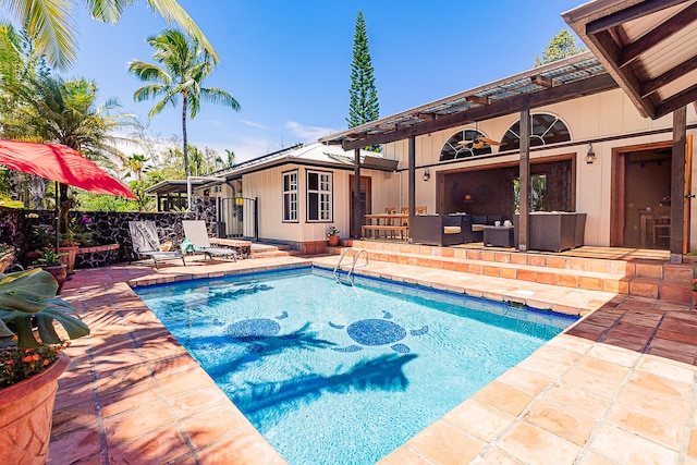 outdoor pool featuring a patio and outdoor lounge area