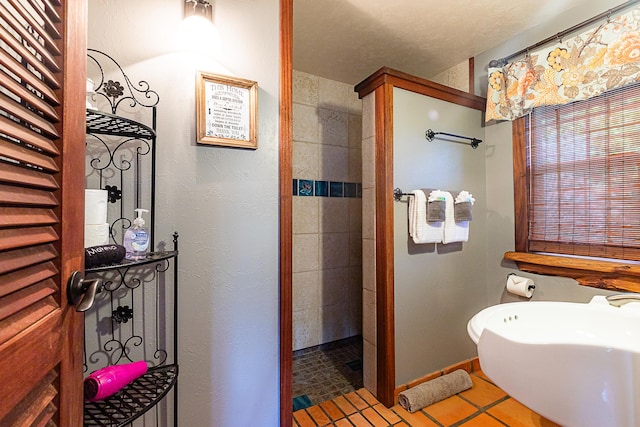 full bathroom featuring a walk in shower and tile patterned flooring