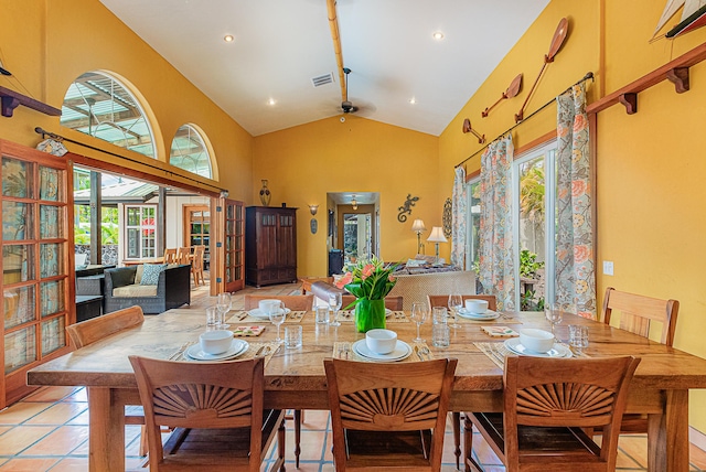 dining room with high vaulted ceiling, french doors, and beam ceiling