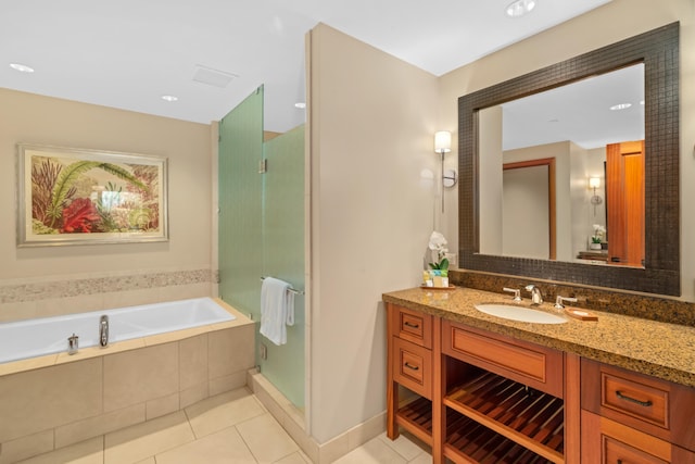 full bathroom with tile patterned flooring, vanity, a stall shower, and a bath