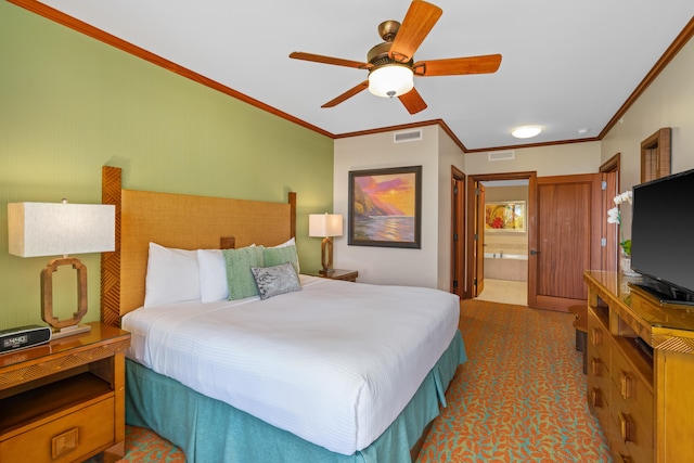 bedroom featuring ornamental molding, ensuite bathroom, and a ceiling fan