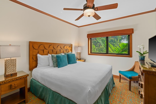 bedroom with baseboards, crown molding, and a ceiling fan