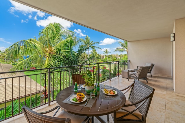 balcony featuring outdoor dining area