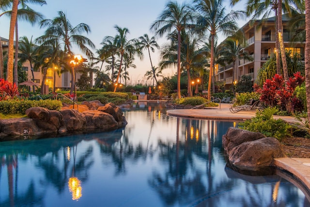 view of pool featuring a water view