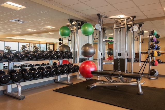 exercise room with a drop ceiling