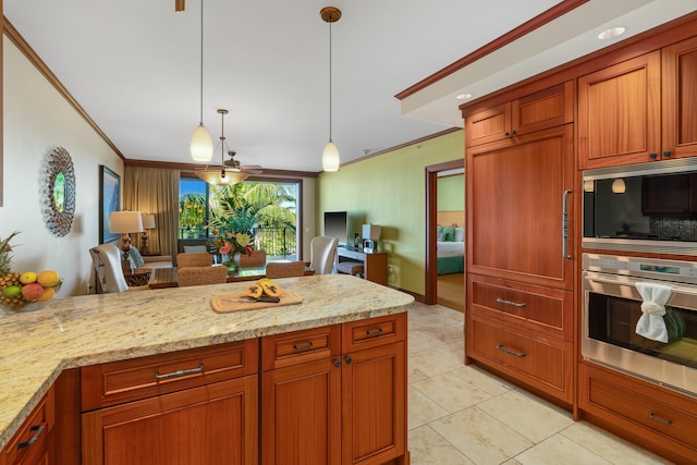 kitchen with stainless steel oven, built in microwave, light stone counters, pendant lighting, and ornamental molding