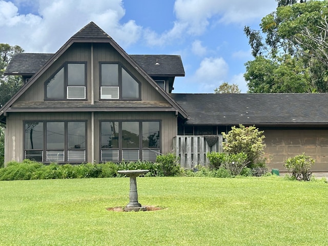 5201 Puuwai Rd, Kalaheo, HI 96741 - rear view of house featuring a lawn and a shingled roof