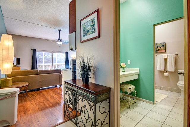 355 Kalanianaole St Unit 119, Hilo, HI 96720 - corridor with a textured ceiling and light wood-style floors