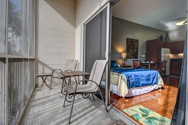 355 Kalanianaole St Unit 119, Hilo, HI 96720 - bedroom with freestanding refrigerator and wood finished floors