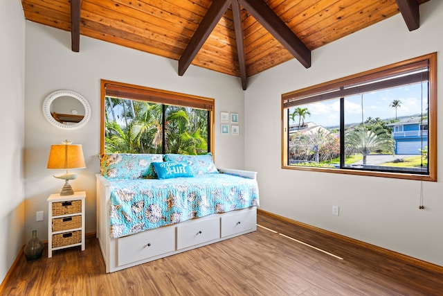 bedroom with wood finished floors, baseboards, and wooden ceiling