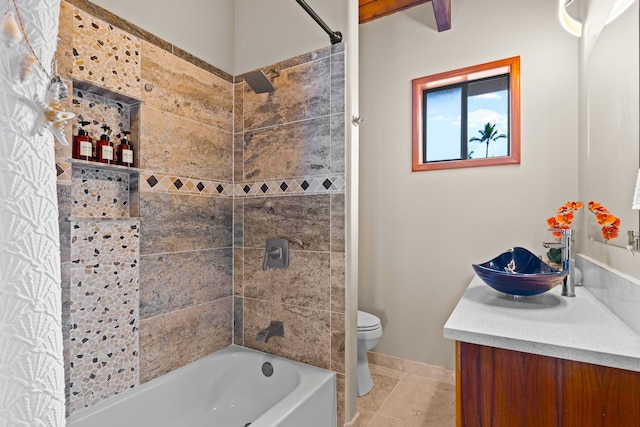 full bath featuring bathtub / shower combination, vanity, toilet, baseboards, and tile patterned flooring
