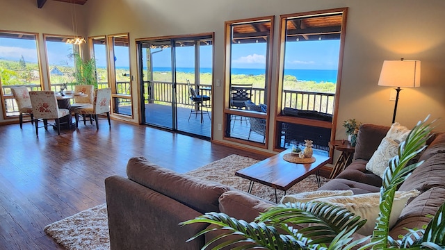living room with wood finished floors and a water view