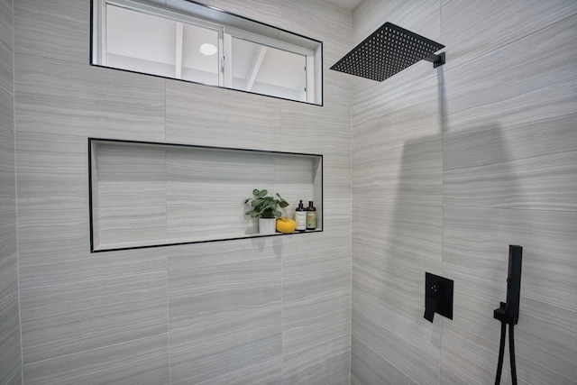 bathroom with a tile shower