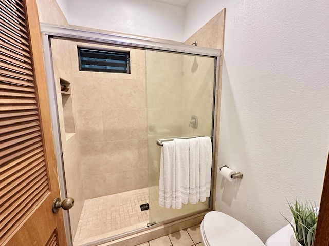 2253 Poipu Rd Unit 446, Koloa, HI 96756 - full bathroom with toilet, a stall shower, tile patterned floors, and a textured wall