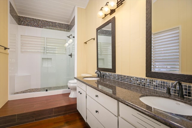77-6486 Walua Rd, Kailua-Kona, HI 96740 - bathroom with toilet, wood finished floors, a tile shower, double vanity, and backsplash