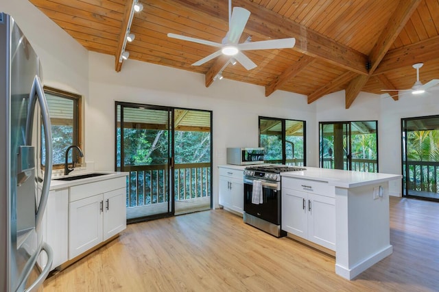 5-1105 Kuhio Hwy Unit 5, Kilauea, HI 96754 - kitchen with appliances with stainless steel finishes, a sink, a ceiling fan, wooden ceiling, and a peninsula