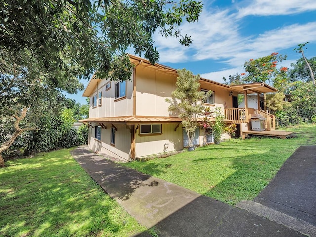 74-5156 Kialoa Pl, Kailua-Kona, HI 96740 - rear view of property featuring a lawn and a deck
