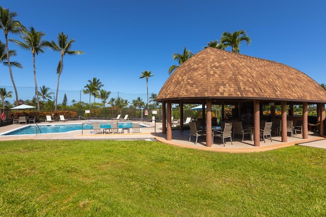 community pool featuring a gazebo and a patio area