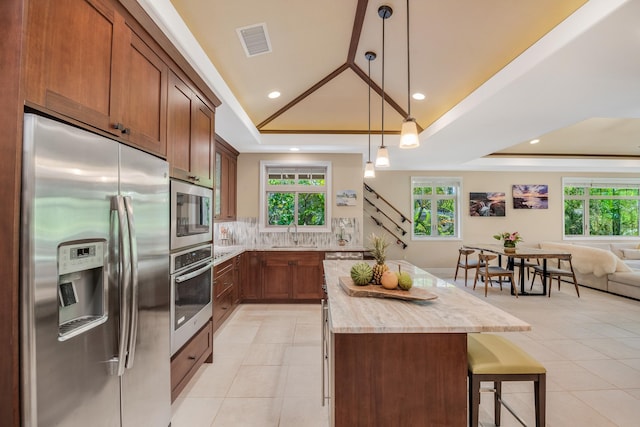 68-1122-N Kaniku Dr Unit 501591, Kamuela, HI 96743 - kitchen with appliances with stainless steel finishes, a tray ceiling, a sink, light tile patterned floors, and recessed lighting