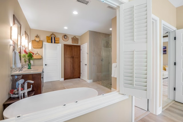 68-1122-N Kaniku Dr Unit 501591, Kamuela, HI 96743 - full bath with a stall shower, a bath, vanity, recessed lighting, and a spacious closet
