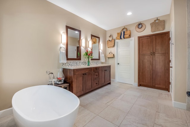 68-1122-N Kaniku Dr Unit 501591, Kamuela, HI 96743 - full bathroom featuring double vanity, a soaking tub, baseboards, and recessed lighting
