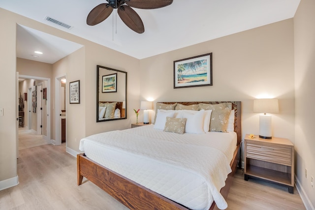 68-1122-N Kaniku Dr Unit 501591, Kamuela, HI 96743 - bedroom with light wood-type flooring, baseboards, a ceiling fan, and ensuite bath