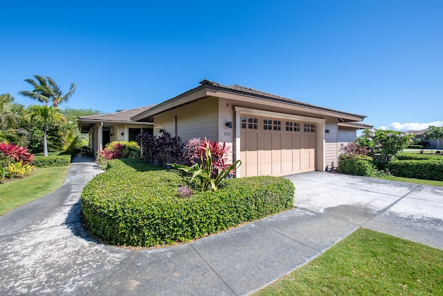 68-1122-N Kaniku Dr Unit 501591, Kamuela, HI 96743 - view of front of property featuring concrete driveway and a garage