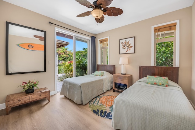 68-1122-N Kaniku Dr Unit 501591, Kamuela, HI 96743 - bedroom with access to outside, light wood-style flooring, baseboards, and a ceiling fan