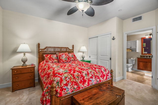 2611 Kiahuna Plantation Dr Unit 13D, Koloa, HI 96756 - bedroom with light carpet, a sink, baseboards, and a closet