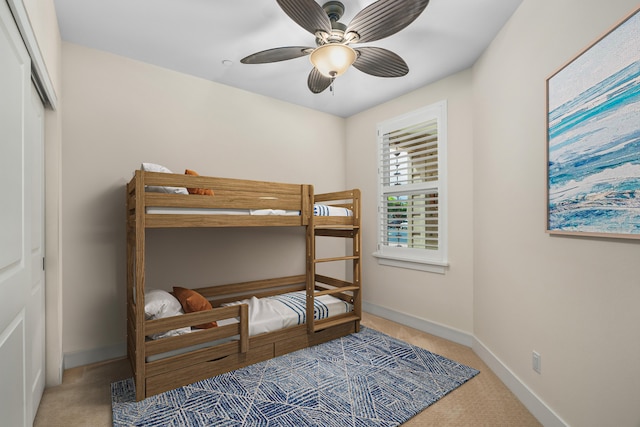 2611 Kiahuna Plantation Dr Unit 13D, Koloa, HI 96756 - carpeted bedroom featuring baseboards, a ceiling fan, and a closet