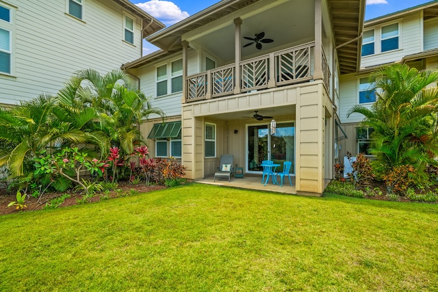 2611 Kiahuna Plantation Dr Unit 13D, Koloa, HI 96756 - rear view of property featuring a balcony, a ceiling fan, and a yard