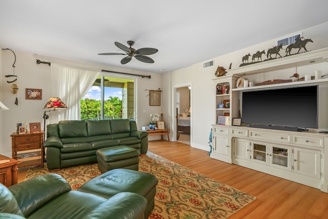 2611 Kiahuna Plantation Dr Unit 13D, Koloa, HI 96756 - living area with a ceiling fan and light wood-style floors