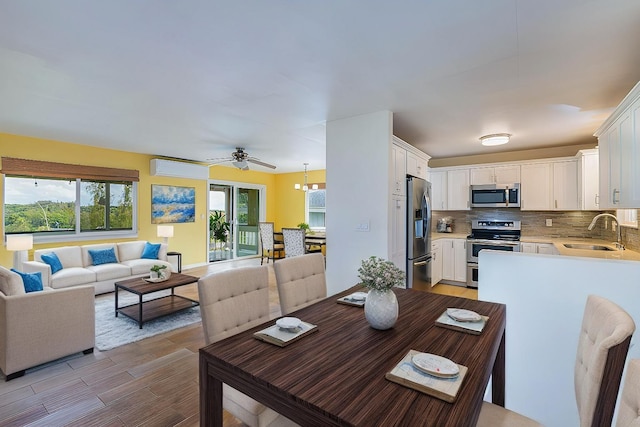 5372 Kumole St, Kapaa, HI 96746 - dining space with healthy amount of natural light, light wood-style floors, and a ceiling fan