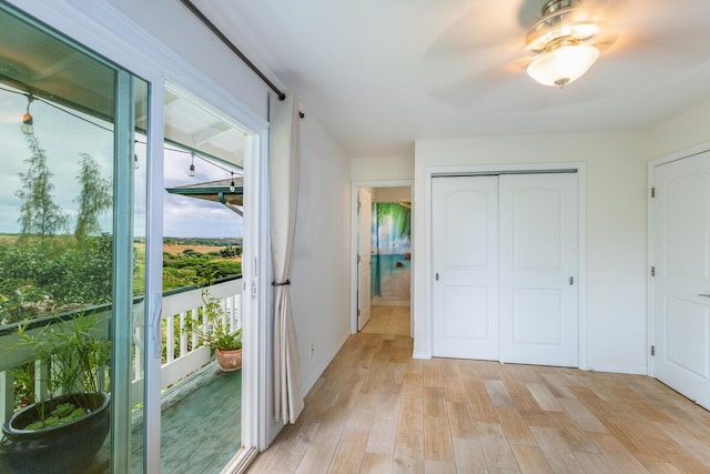 5372 Kumole St, Kapaa, HI 96746 - unfurnished bedroom featuring light wood finished floors, baseboards, a closet, and a ceiling fan