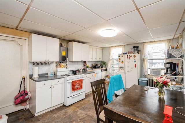 73 Laidlaw Ave, Jersey City, NJ 07306 - kitchen with white appliances, a paneled ceiling, white cabinetry, dark countertops, and electric water heater