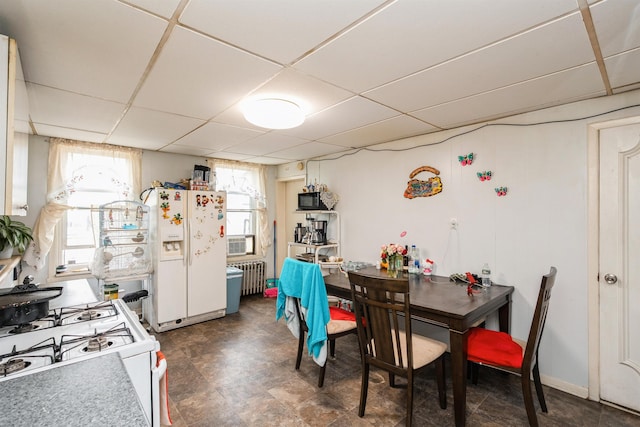 73 Laidlaw Ave, Jersey City, NJ 07306 - dining space featuring radiator heating unit and a drop ceiling