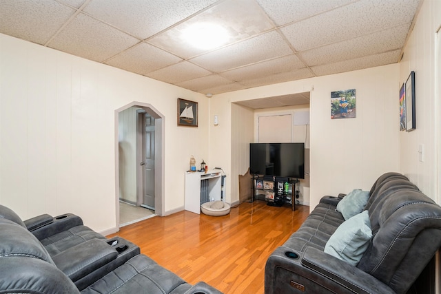 73 Laidlaw Ave, Jersey City, NJ 07306 - living area with light wood-type flooring, arched walkways, and a paneled ceiling