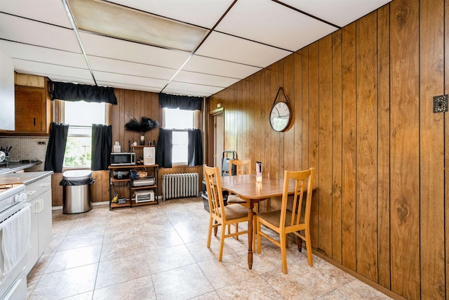 73 Laidlaw Ave, Jersey City, NJ 07306 - dining space featuring radiator heating unit, wooden walls, and a paneled ceiling