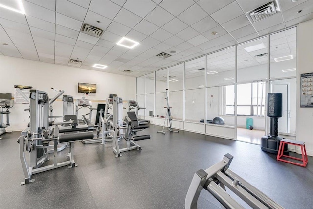 gym featuring a drop ceiling and visible vents