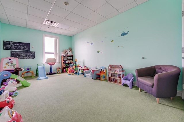 recreation room with visible vents, a paneled ceiling, and carpet