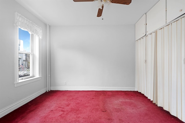 kitchen with light wood-type flooring, ceiling fan, sink, radiator heating unit, and white stove