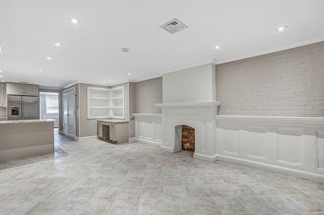 531 Bloomfield St Unit 1, Hoboken, NJ 07030 - unfurnished living room with crown molding, recessed lighting, brick wall, and baseboards