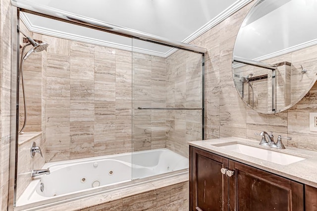 531 Bloomfield St Unit 1, Hoboken, NJ 07030 - bathroom featuring ornamental molding, a combined bath / shower with jetted tub, tile walls, and vanity