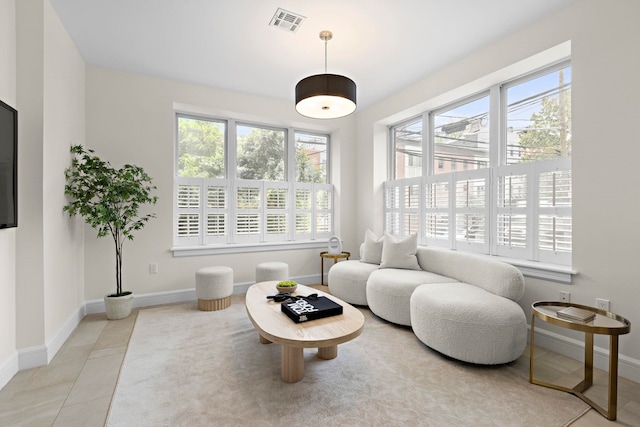 471 Monmouth St Unit 1, Jersey City, NJ 07302 - tiled living room featuring plenty of natural light and baseboards