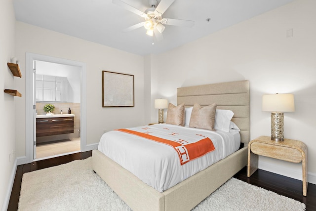 471 Monmouth St Unit 1, Jersey City, NJ 07302 - bedroom featuring baseboards, dark wood-type flooring, ensuite bathroom, and a ceiling fan
