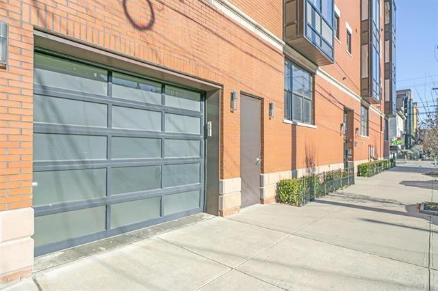 471 Monmouth St Unit 1, Jersey City, NJ 07302 - garage featuring concrete driveway